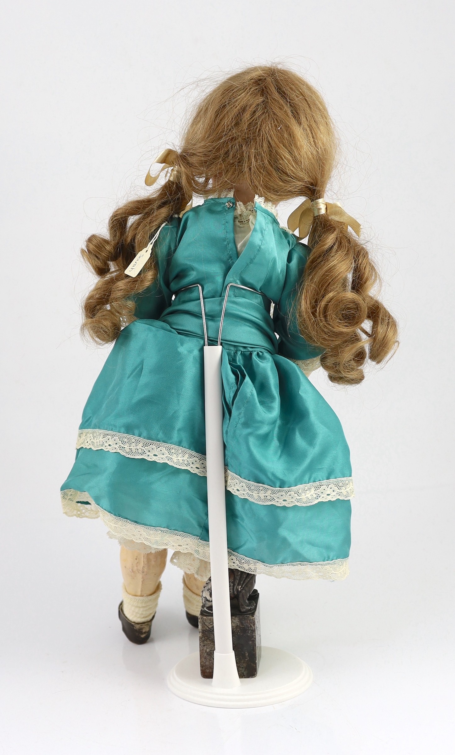 A bisque fashion doll, French, circa 1900, 20in.